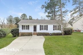 Fuquay Varina house for rent - a white house with a sidewalk in front of it