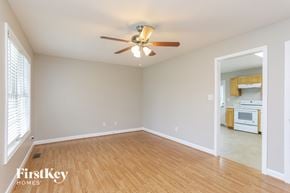 Fuquay Varina house for rent - a living room with wood flooring and a ceiling fan