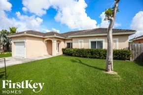 Homestead house for rent - A house with a tree in front of it is for sale with FirstKey Homes.