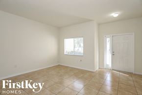 Homestead house for rent - A room with a tiled floor and a door.