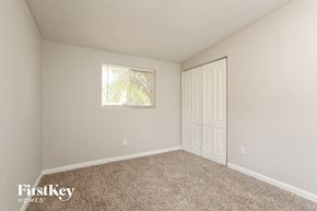 Altamonte Springs house for rent - a bedroom with carpet and a window and a door