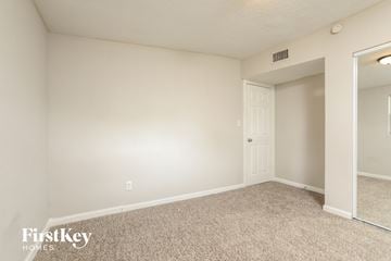 Altamonte Springs house for rent - a spacious living room with white walls and carpet