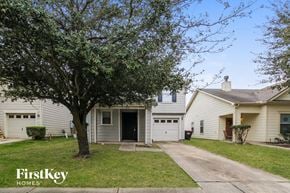 Houston house for rent - A house with a tree in front of it.
