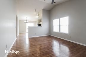 Indianapolis house for rent - an empty living room with white walls and wood floors