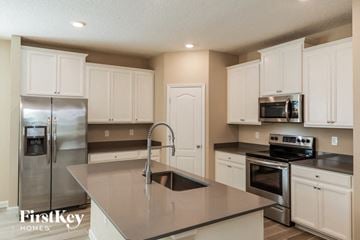 St. Augustine house for rent - A kitchen with a stainless steel refrigerator and a stainless steel oven.