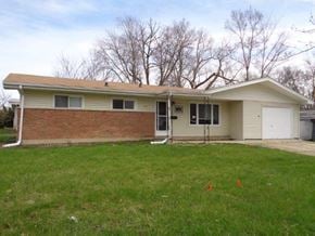 Park Forest house for rent - a white and brick house with a grass yard