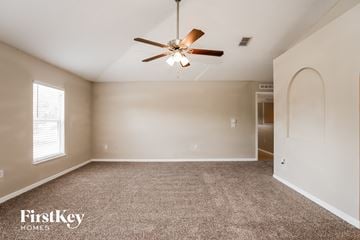 Palm Bay house for rent - the spacious living room with ceiling fan and carpet