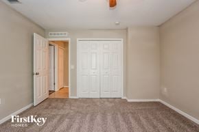 Palm Bay house for rent - a bedroom with two closets and a carpeted floor