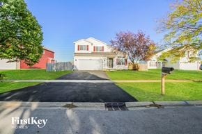 Bolingbrook house for rent - A house with a driveway in front of it.