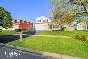 Bolingbrook house for rent - A residential area with houses and a mailbox.