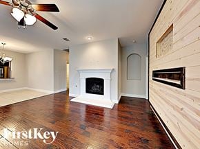 Fate house for rent - the living room has a fireplace and hardwood floors