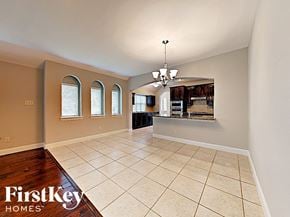Fate house for rent - an open kitchen and living room with tile flooring