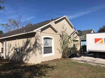 Orlando house for rent - the front of a house with a white truck in front of it