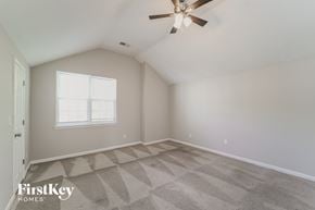 Charlotte house for rent - a bedroom with a ceiling fan and a window