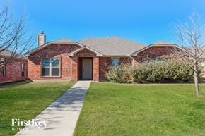 Lancaster house for rent - a brick house with a sidewalk in front of it