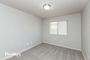 Lancaster house for rent - a bedroom with white walls and carpet and a window