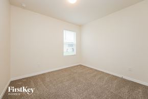 Cape Coral house for rent - a spacious room with carpet and a window