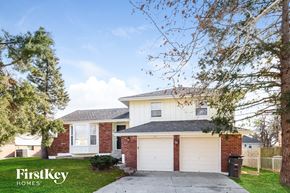 Belton house for rent - a white and brick house with a driveway
