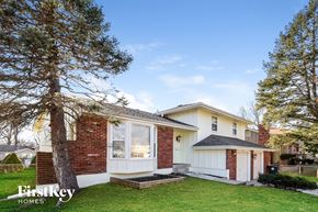 Belton house for rent - a small white and brick house with a yard and a tree