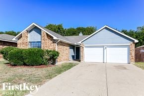 Arlington house for rent - a home with a white garage door and a brick house