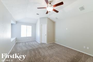 Arlington house for rent - the spacious living room with ceiling fan and carpet