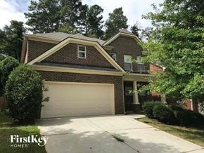 Lawrenceville house for rent - a house with a garage door in front of it