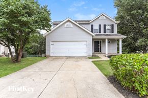 Wentzville house for rent - a white house with a white garage door