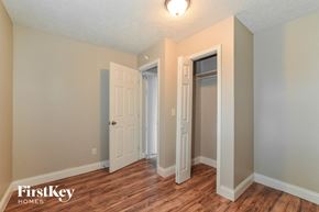 Casselberry house for rent - a bedroom with a hard wood floor and two closets