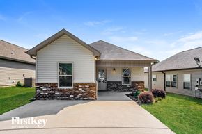 Odenville house for rent - a white house with a driveway in front of it