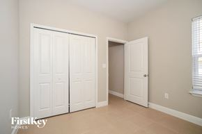 Poinciana house for rent - a bedroom with two closets and two doors