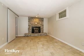 Lee's Summit house for rent - the living room has a fireplace and tile flooring