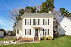 Wake Forest house for rent - A white house with a brick staircase leading to the front door.