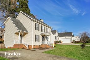 Wake Forest house for rent - A two-story house with a front porch and a garage.