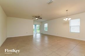 Cape Coral house for rent - A spacious room with a ceiling fan and tiled floor.