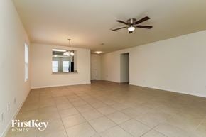 Cape Coral house for rent - A spacious room with a ceiling fan and a window.