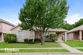 Lancaster house for rent - A tree in front of a brick house with the words "Firstkey Homes" written on the bottom.