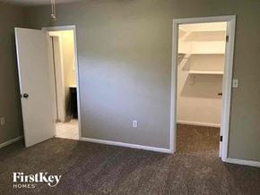 Casselberry house for rent - a bedroom with a closet and an open door to a bathroom