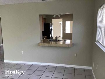 Casselberry house for rent - a view of a kitchen with a sink and a mirror