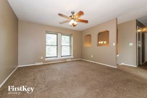 Excelsior Springs house for rent - the master bedroom is spacious and updated with carpeting and a ceiling fan