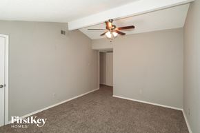 Mansfield house for rent - the living room of a home with a ceiling fan