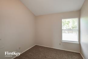 Mansfield house for rent - the bedroom of a home with a window and carpet
