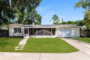 Winter Park house for rent - A house with a garage and a driveway is for sale.