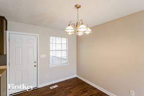 Birmingham house for rent - a living room with a white door and a chandelier