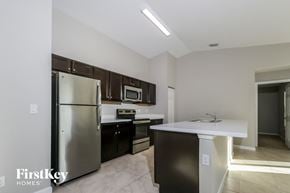 Port St. Lucie house for rent - a kitchen with stainless steel appliances and a white counter top