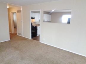 Wauconda house for rent - an empty living room with a kitchen in it