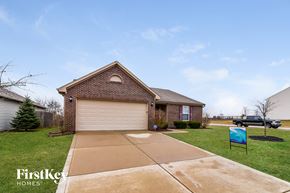 Greenwood house for rent - a house with a driveway and a garage door