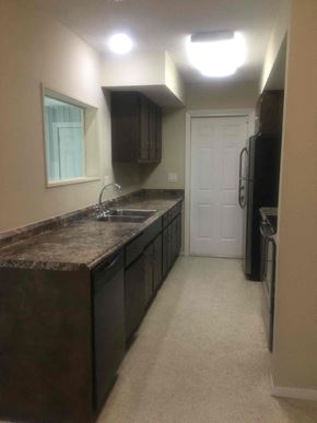Port St. Lucie house for rent - a kitchen with a long counter top and a sink