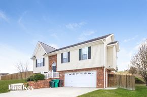 High Point house for rent - a white house with a white garage door