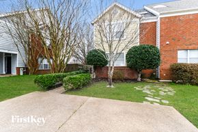 Memphis house for rent - A brick house with a tree in front of it.