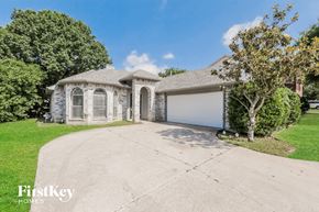 Mckinney house for rent - A large house with a driveway in front of it.